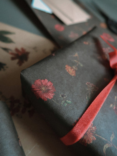 Florals on dark green kraft wrapping paper