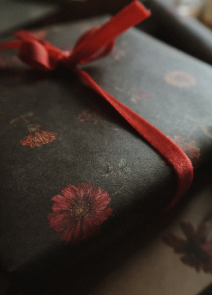 Florals on dark green kraft wrapping paper