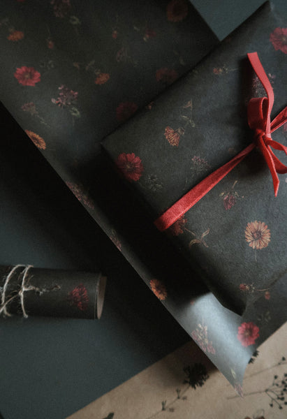 Florals on dark green kraft wrapping paper