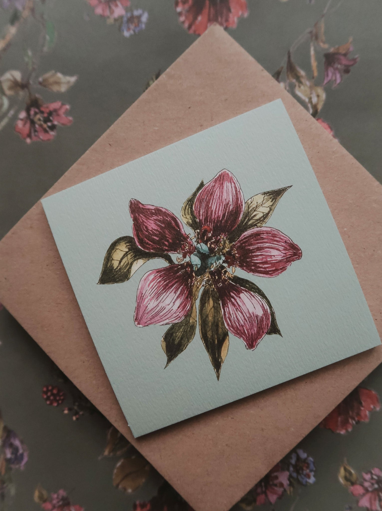Purple flower on light blue small flat card