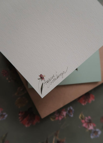 Light purple flower on light blue small flat card