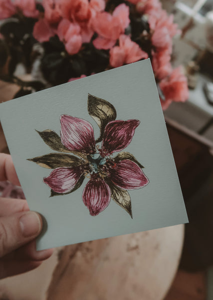Purple flower on light blue small flat card