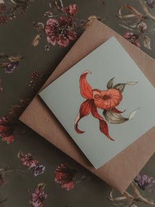 Orange flower on light blue small flat card
