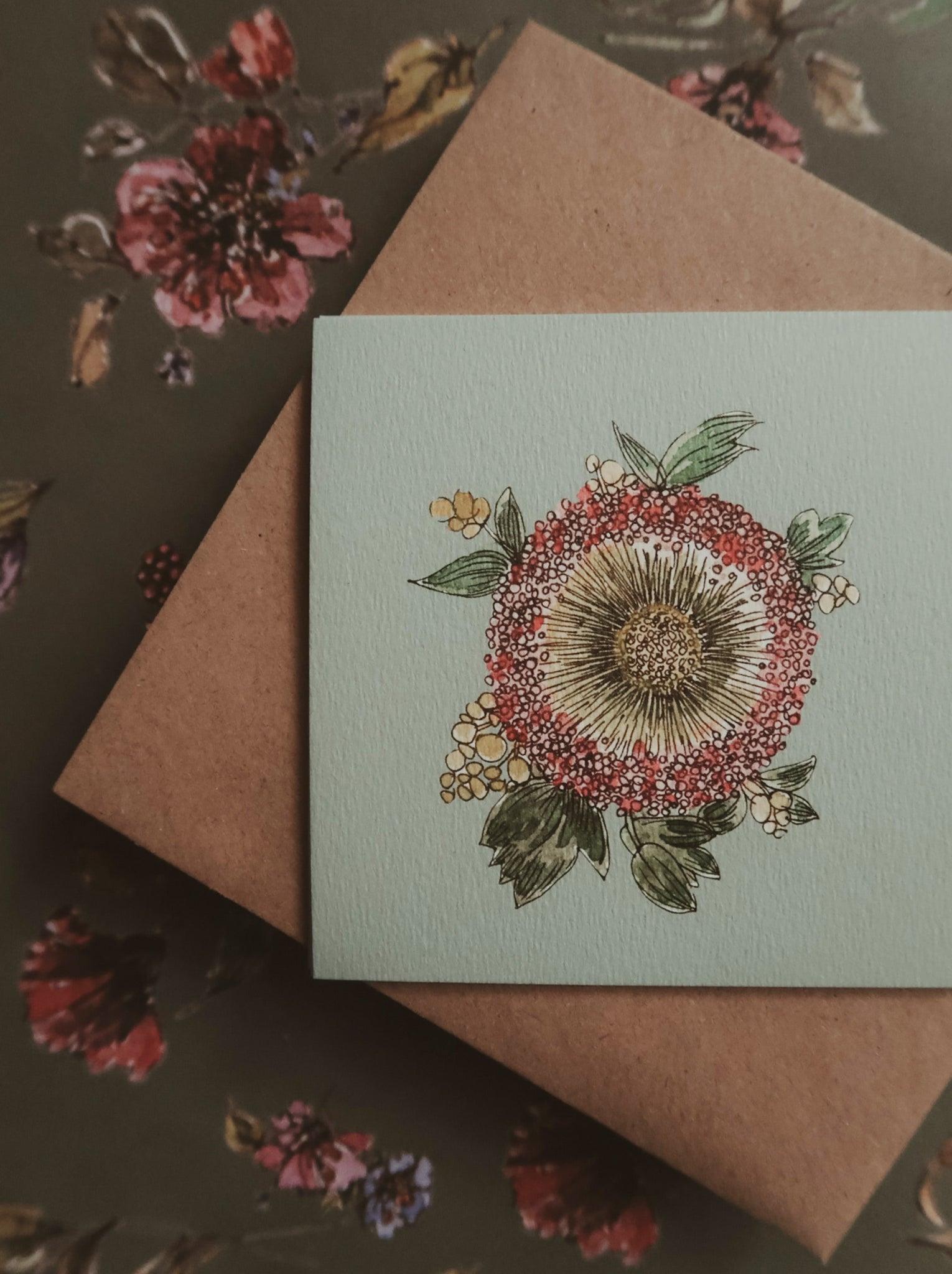 Green flower on light blue small flat card