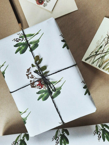 Green leaves white wrapping paper