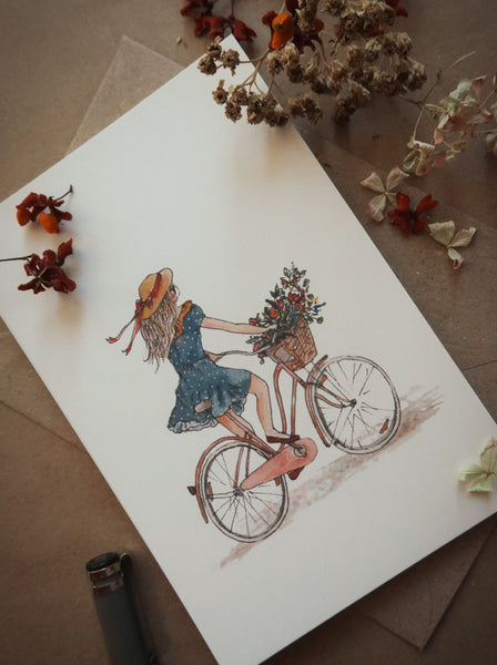 Girl on a bicycle / postcard