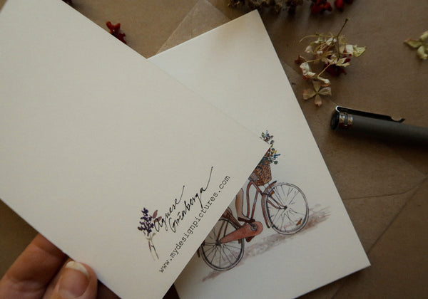 Girl on a bicycle / postcard