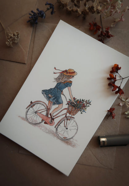 Girl on a bicycle / postcard